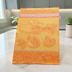 Yellow and orange French tea towel with woven lemon and citrus slice motifs and decorative borders, by Coucke.