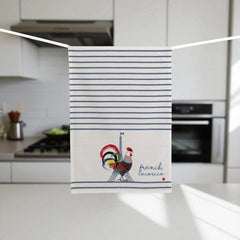 French tea towel with printed rooster and Eiffel Tower design, blue stripes, and 'French Cocorico' text on eco-friendly white fabric.