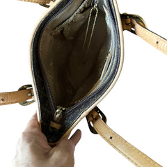 Preloved La Tour Eiffel Paris 1887 brown and tan leather shoulder bag with gold-tone hardware, adjustable handles, and signature logo detailing—elegant bucket silhouette.