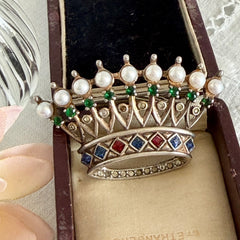 Vintage 1945 Trifari sterling crown brooch designed by Alfred Philippe, featuring restored AAA natural pearls, multicolor vintage rhinestones, and the original Trifari crown Sterling Pat. Pend 140779 markings, shown from various angles to display details, condition, and craftsmanship.