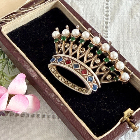 Vintage 1945 Trifari sterling crown brooch designed by Alfred Philippe, featuring restored AAA natural pearls, multicolor vintage rhinestones, and the original Trifari crown Sterling Pat. Pend 140779 markings, shown from various angles to display details, condition, and craftsmanship.
