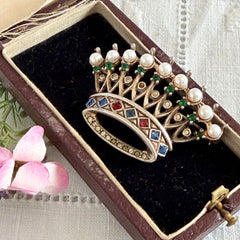 Vintage 1945 Trifari sterling crown brooch designed by Alfred Philippe, featuring restored AAA natural pearls, multicolor vintage rhinestones, and the original Trifari crown Sterling Pat. Pend 140779 markings, shown from various angles to display details, condition, and craftsmanship.