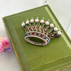 Vintage 1945 Trifari sterling crown brooch designed by Alfred Philippe, featuring restored AAA natural pearls, multicolor vintage rhinestones, and the original Trifari crown Sterling Pat. Pend 140779 markings, shown from various angles to display details, condition, and craftsmanship.