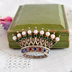 Vintage 1945 Trifari sterling crown brooch designed by Alfred Philippe, featuring restored AAA natural pearls, multicolor vintage rhinestones, and the original Trifari crown Sterling Pat. Pend 140779 markings, shown from various angles to display details, condition, and craftsmanship.