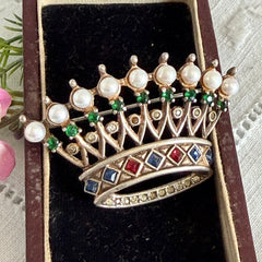 Vintage 1945 Trifari sterling crown brooch designed by Alfred Philippe, featuring restored AAA natural pearls, multicolor vintage rhinestones, and the original Trifari crown Sterling Pat. Pend 140779 markings, shown from various angles to display details, condition, and craftsmanship.