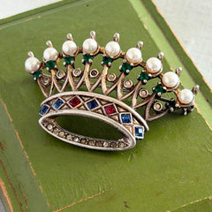Vintage 1945 Trifari sterling crown brooch designed by Alfred Philippe, featuring restored AAA natural pearls, multicolor vintage rhinestones, and the original Trifari crown Sterling Pat. Pend 140779 markings, shown from various angles to display details, condition, and craftsmanship.