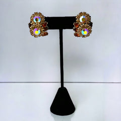 Vintage 1950s Trifari Crown clip‑on earrings with AB topaz rhinestones and gold‑tone floral design