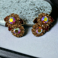Vintage 1950s Trifari Crown clip‑on earrings with AB topaz rhinestones and gold‑tone floral design