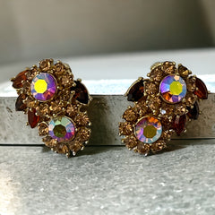 Vintage 1950s Trifari Crown clip‑on earrings with AB topaz rhinestones and gold‑tone floral design