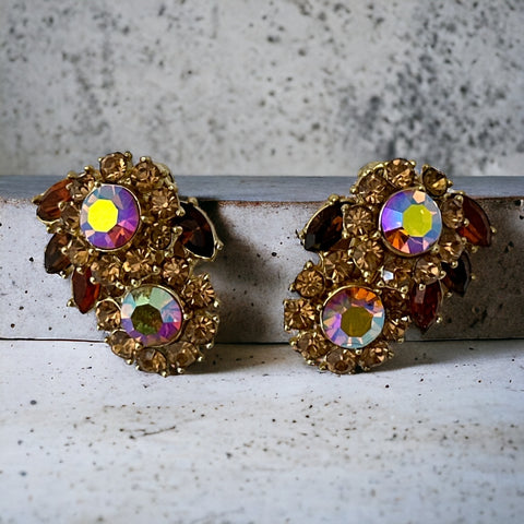 Vintage 1950s Trifari Crown clip‑on earrings with AB topaz rhinestones and gold‑tone floral design