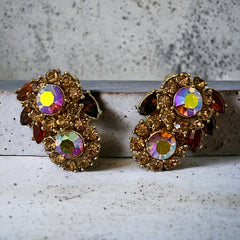 Vintage 1950s Trifari Crown clip‑on earrings with AB topaz rhinestones and gold‑tone floral design