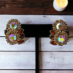 Vintage 1950s Trifari Crown clip‑on earrings with AB topaz rhinestones and gold‑tone floral design