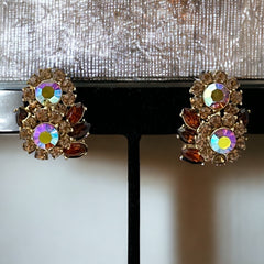 Vintage 1950s Trifari Crown clip‑on earrings with AB topaz rhinestones and gold‑tone floral design