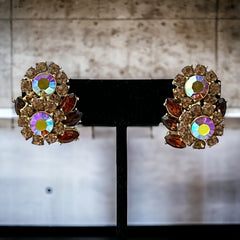 Vintage 1950s Trifari Crown clip‑on earrings with AB topaz rhinestones and gold‑tone floral design