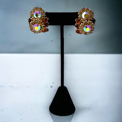 Vintage 1950s Trifari Crown clip‑on earrings with AB topaz rhinestones and gold‑tone floral design
