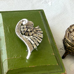 Vintage Trifari Crown Alfred Philippe 1950 rhodium‑plated brooch with pave and baguette rhinestones.