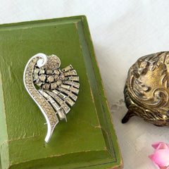 Vintage Trifari Crown Alfred Philippe 1950 rhodium‑plated brooch with pave and baguette rhinestones.