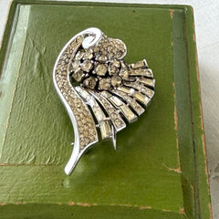 Vintage Trifari Crown Alfred Philippe 1950 rhodium‑plated brooch with pave and baguette rhinestones.