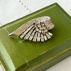 Vintage Trifari Crown Alfred Philippe 1950 rhodium‑plated brooch with pave and baguette rhinestones.