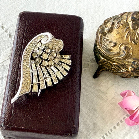 Vintage Trifari Crown Alfred Philippe 1950 rhodium‑plated brooch with pave and baguette rhinestones.