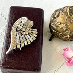 Vintage Trifari Crown Alfred Philippe 1950 rhodium‑plated brooch with pave and baguette rhinestones.