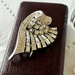 Vintage Trifari Crown Alfred Philippe 1950 rhodium‑plated brooch with pave and baguette rhinestones.