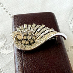 Vintage Trifari Crown Alfred Philippe 1950 rhodium‑plated brooch with pave and baguette rhinestones.