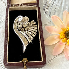 Vintage Trifari Crown Alfred Philippe 1950 rhodium‑plated brooch with pave and baguette rhinestones.