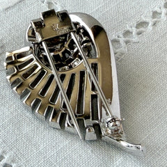 Vintage Trifari Crown Alfred Philippe 1950 rhodium‑plated brooch with pave and baguette rhinestones.