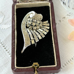 Vintage Trifari Crown Alfred Philippe 1950 rhodium‑plated brooch with pave and baguette rhinestones.