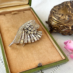 Vintage Trifari Crown Alfred Philippe 1950 rhodium‑plated brooch with pave and baguette rhinestones.
