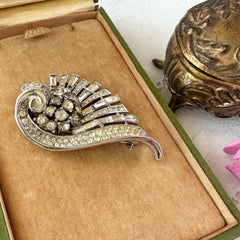 Vintage Trifari Crown Alfred Philippe 1950 rhodium‑plated brooch with pave and baguette rhinestones.