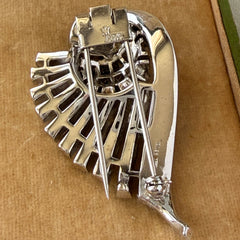 Vintage Trifari Crown Alfred Philippe 1950 rhodium‑plated brooch with pave and baguette rhinestones.