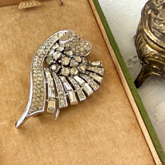 Vintage Trifari Crown Alfred Philippe 1950 rhodium‑plated brooch with pave and baguette rhinestones.
