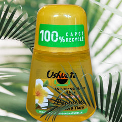 Ushuaia Roll‑on deodorant with bright yellow cap and green label, featuring Polynesian monoi oil and tiare flower extract; vegan formula with natural ingredients, 48‑hour protection, eco‑friendly packaging with 100% recycled cap and recyclable bottle.