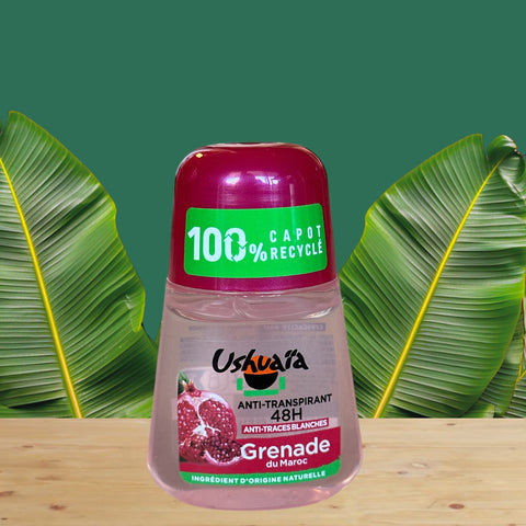 Roll-on deodorant with red cap and green label, featuring Moroccan pomegranate extract; eco-conscious packaging with 100% recycled cap and 48-hour protection claim, photographed to highlight natural ingredients and vibrant pink liquid.