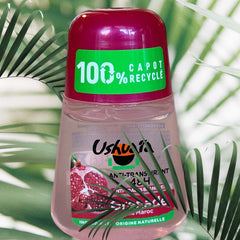 Ushuaia Roll-on deodorant with red cap and green label, featuring Moroccan pomegranate extract; eco-conscious packaging with 100% recycled cap and 48-hour protection claim, photographed to highlight natural ingredients and vibrant pink liquid.