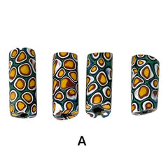 A set of vintage Venetian millefiori African trade beads in vibrant green and yellow. The tube-shaped glass beads, originating from Ghana, feature intricate floral patterns and showcase the rich history of 19th and 20th-century trade. Some beads show minor chips due to age, adding to their authentic vintage charm.