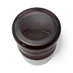 Vintage Villeroy & Boch ruby red glass vase with modernist etched pattern, shown on a neutral surface. The low, wide silhouette and translucent red hue evoke sculptural elegance, with geometric etching wrapping around the bowl. Signed on the underside, this French glass piece reflects 1980s–1990s design clarity