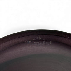 Vintage Villeroy & Boch ruby red glass vase with modernist etched pattern, shown on a neutral surface. The low, wide silhouette and translucent red hue evoke sculptural elegance, with geometric etching wrapping around the bowl. Signed on the underside, this French glass piece reflects 1980s–1990s design clarity