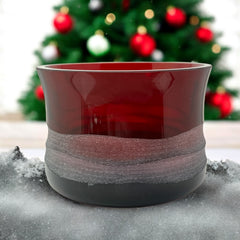 Vintage Villeroy & Boch ruby red glass vase with modernist etched pattern, shown on a neutral surface. The low, wide silhouette and translucent red hue evoke sculptural elegance, with geometric etching wrapping around the bowl. Signed on the underside, this French glass piece reflects 1980s–1990s design clarity