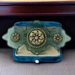 Vintage Vogue Bijoux green resin statement brooch with gold‑tone floral motifs and clear rhinestones.