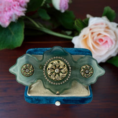 Vintage Vogue Bijoux green resin statement brooch with gold‑tone floral motifs and clear rhinestones.
