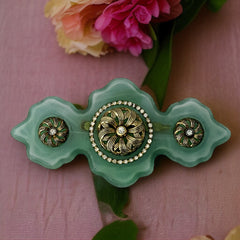 Vintage Vogue Bijoux green resin statement brooch with gold‑tone floral motifs and clear rhinestones.