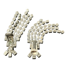 Vintage 1960s clip-on earrings with cascading clear rhinestone dangles, featuring chaton and baguette stones in a waterfall design. Back view