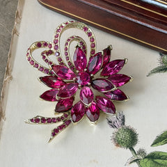 Vintage Weiss fuchsia rhinestone floral brooch and matching clip‑on earrings in light gold tone with layered petal design.