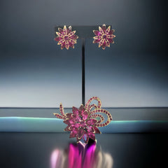 Vintage Weiss fuchsia rhinestone floral brooch and matching clip‑on earrings in light gold tone with layered petal design.
