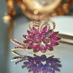 Vintage Weiss fuchsia rhinestone floral brooch and matching clip‑on earrings in light gold tone with layered petal design.