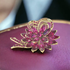 Vintage Weiss fuchsia rhinestone floral brooch and matching clip‑on earrings in light gold tone with layered petal design.
