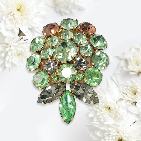 Vintage Weiss green and smoked topaz rhinestone teardrop brooch with gold‑tone setting.